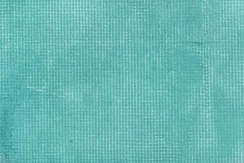 Old turquoise cement wall with net and stains, texture concrete background Stock Photos