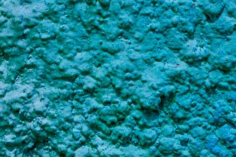 Old turquoise plaster wall texture. Retro painted putty building background w Fotos de archivo