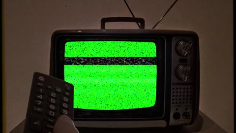 Old TV Green Screen Remote Control Changing Channels Vintage Television Zoom In Stock-Footage 254778828