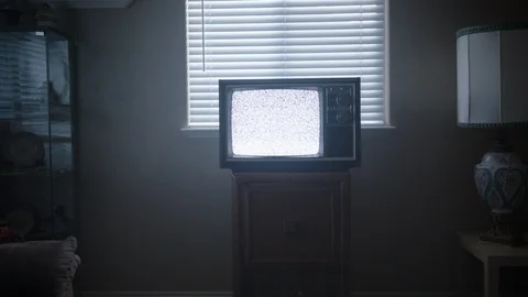 Old TV in Living Room Playing Static as Camera Dollies in. Stock Footage