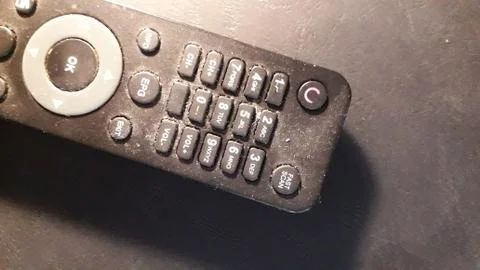 Old the TV remote control is on the table Stock Photos