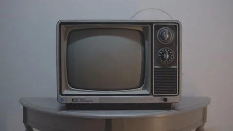 Old TV on Table Gets Turned On Stock Footage 171298415