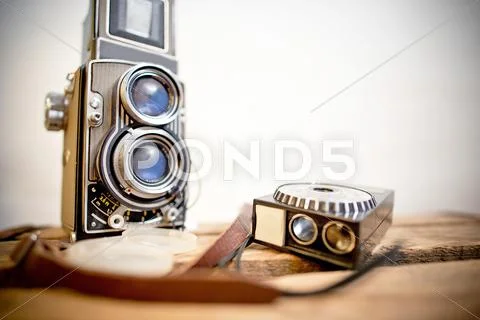 Old twin-lens reflex camera with light meter Stock Photos