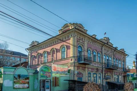 An old two-storey stone building in the center of Kungur. Stock Photos