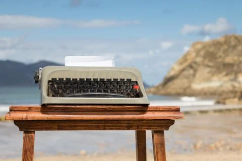 Old typewriter in the beach. Stock Photos