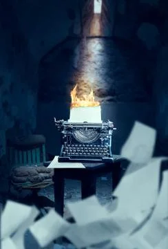 Old typewriter with burning sheet of paper Stock Photos