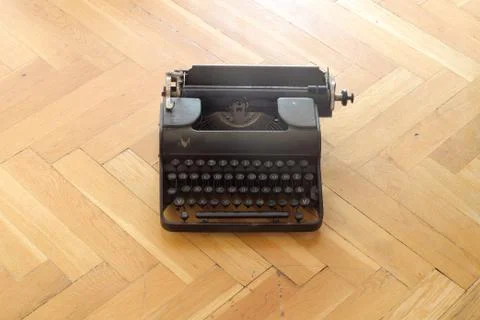 An old typewriter on the floor Stock Photos