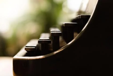 Old typewriter keyboard, on a blurred background Stock Photos