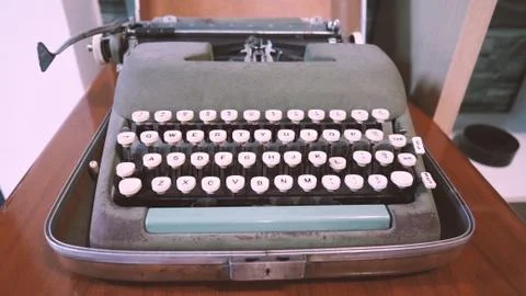 Old typewriter machine in good condition with no paper in feed Stock Photos
