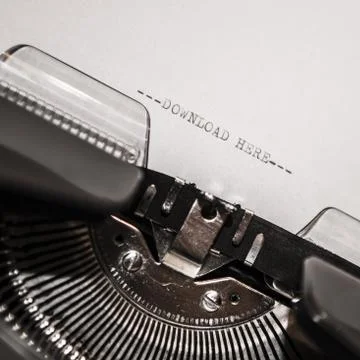Old typewriter with text download here Stock Photos
