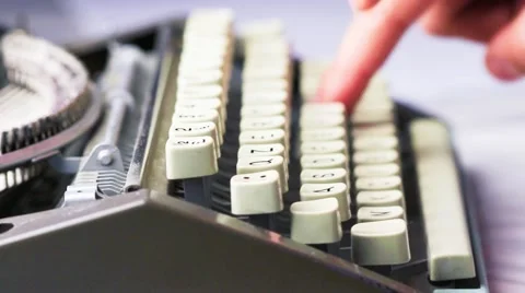 Old typewriter typing. Vintage typewriter being used by male hands seen from Vidéo 47232477