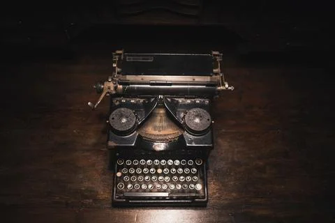 Old typewriter on a wooden table Stock Photos