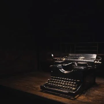 Old typewriter on a wooden table Stock Photos
