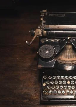 Old typewriter on a wooden table Stock Photos