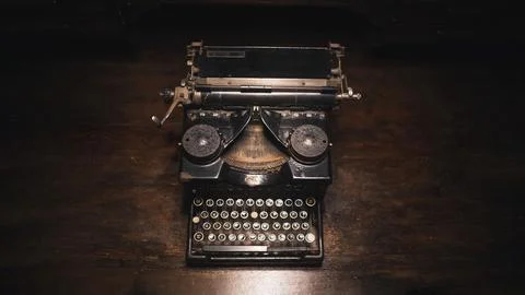 Old typewriter on a wooden table Stock Photos