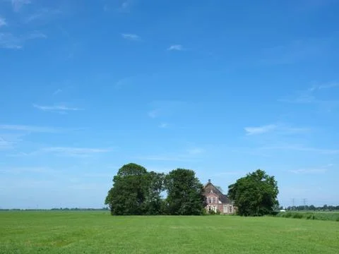 Old typical farm under blue sky in the coutryside just outside city of leeuwa Stock Photos