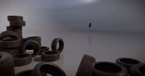 Old tyre spinning, hitting a big group of used car tyres Stock Footage 115168938