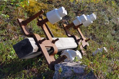 Old, unnecessary elements of power transmission poles lie Stock Photos