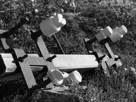 Old, unnecessary elements of power transmission poles lie Stock Photos