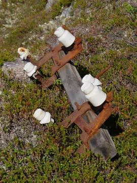Old, unnecessary elements of power transmission poles lie Stock Photos