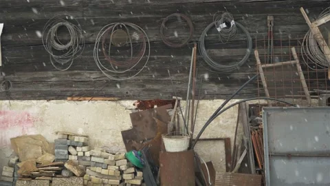 Old unnecessary stuff junk stored in the back yard in countryside in winter Stock Footage 232383824