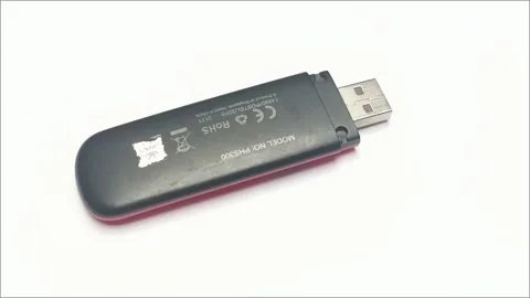 Old USB Wireless Modem Dongle on White Table Close Up Video stock 335804711