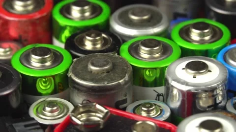Old used batteries of different types rotate on the turntable Stock Footage 152899225
