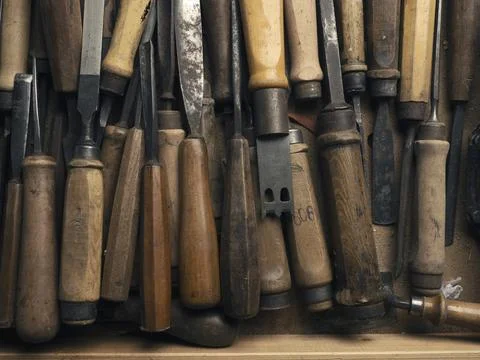 Old used chisel in a workbench drawer, craft or manufacturing concept, Stock Photos