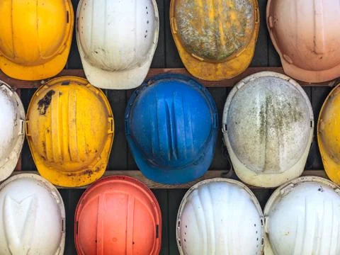 Old used construction helmets Stock Photos