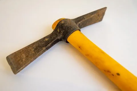 Old, used iron chisel hand tool with yellow handle. Isolated white background. 写真素材