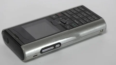 Old used mobile phone on display and moving Stock Footage 111887824