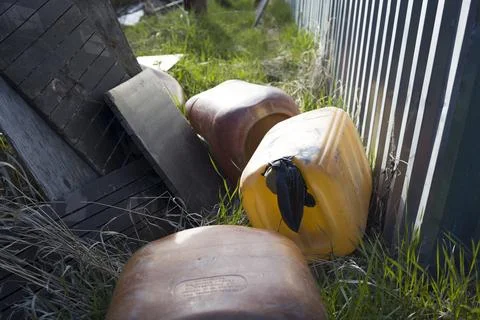 Old used plastic cans on ground Stock Photos