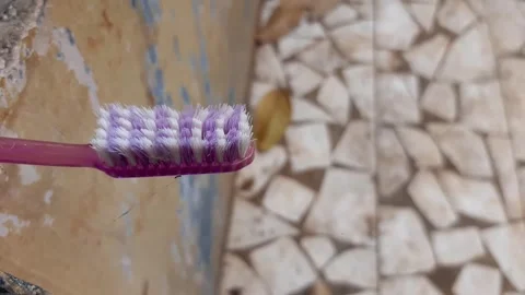 An old used plastic toothbrush Stock Footage 285913576