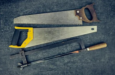 Old used rusty hacksaws close-up, top view Stock Photos