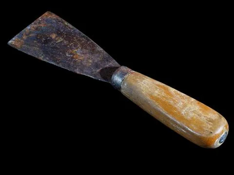 Old used rusty hand scraper isolated on black Stock Photos