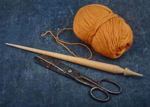 Old used tailoring tools and a skein of woolen thread, shallow depth of sharp Stock Photos