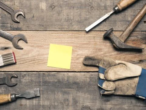 Old used tools with a sticky note Stock Photos