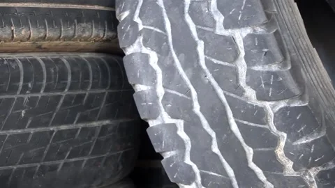 Old used weared car and truck wheels tyres Stock Footage 168575816