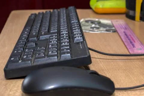 A old useful black keyboard with mouse Stock Photos