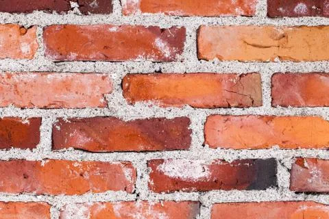Old variable colored brick wall Stock Photos