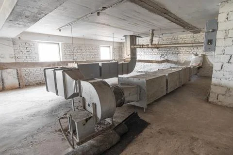 Old ventilation system with many ventilation pipes on the technical floor Stock Photos