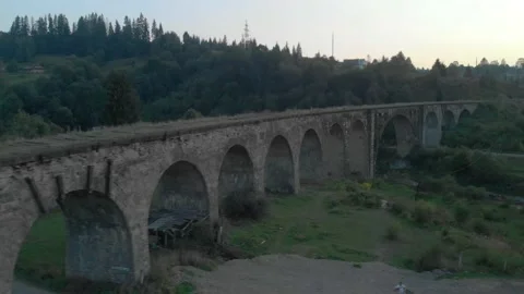 Old viaduct bridge in mountains Stock Footage 157737580