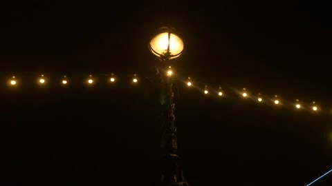 Old Victorian Light with String Lights Bulbs London South Bank Evening Night Stock Footage 221493036