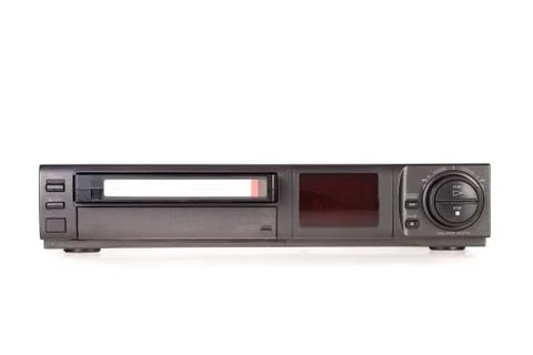 Old video cassette recorder ejecting tape isolated on white background Stock Photos
