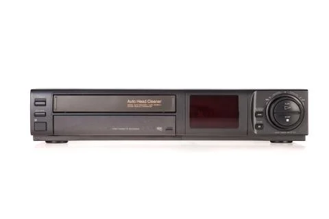 Old video cassette recorder ejecting tape isolated on white background Stock Photos
