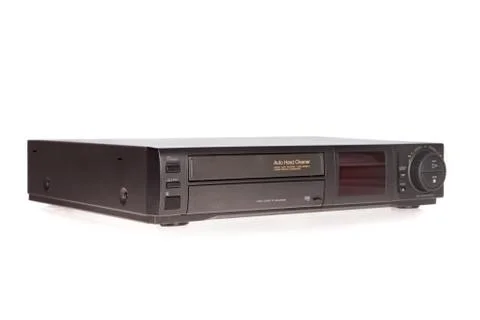 Old video cassette recorder ejecting tape isolated on white background Stock Photos