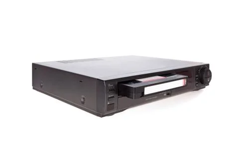 Old video cassette recorder ejecting tape isolated on white background Stock Photos