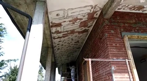 Old video of a construction worker fixing a ceiling Video stock 330161223