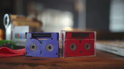 Old videotapes of small size in red and blue from the 90s. VHS Video stock 148465302