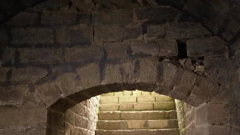 Old viewed bricks Stairs down to the basement of the historic ancient castle Stock Footage 253785537